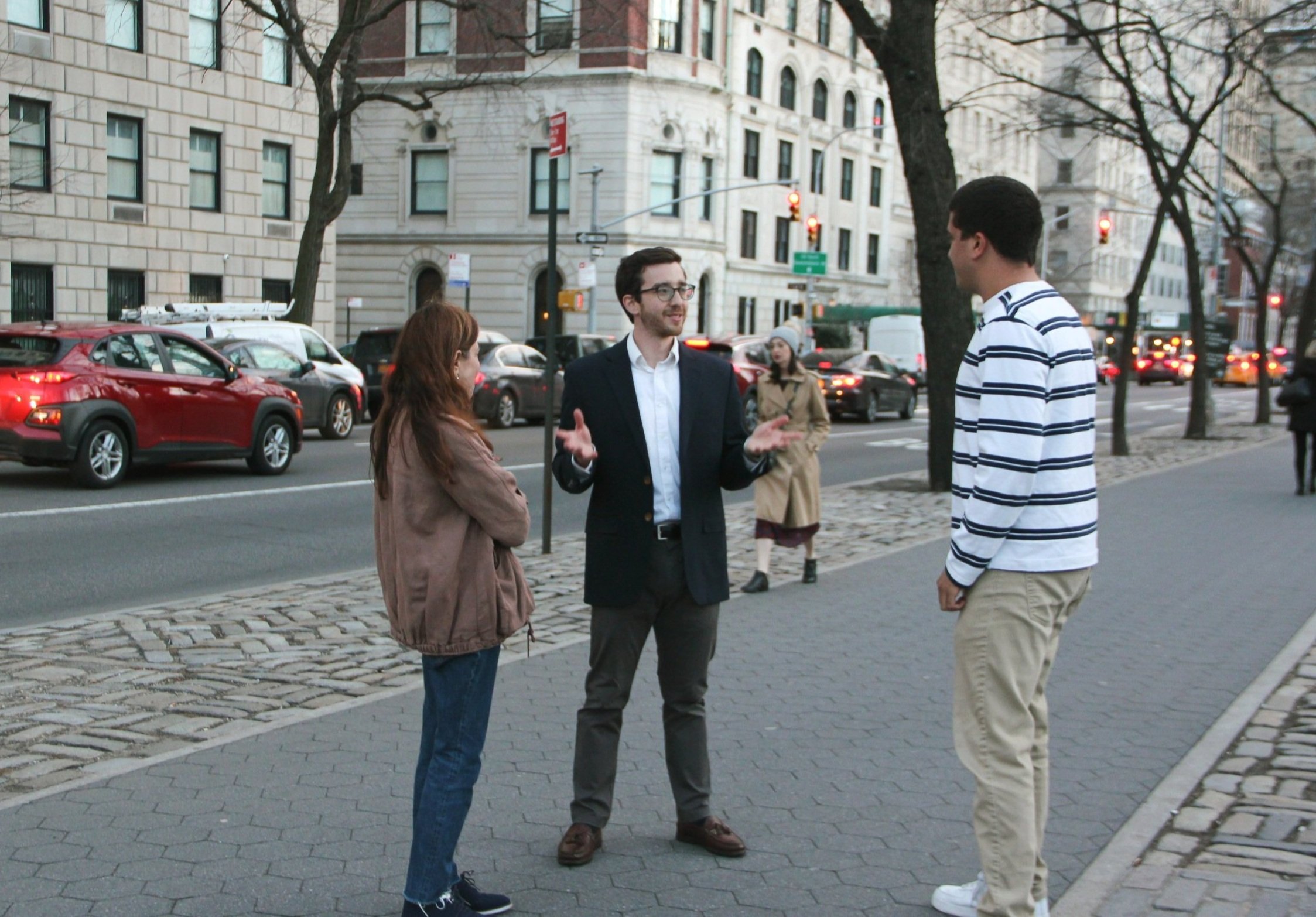Adam Roberts talking with locals on the street in New York